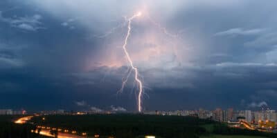 lighting hitting middle of city