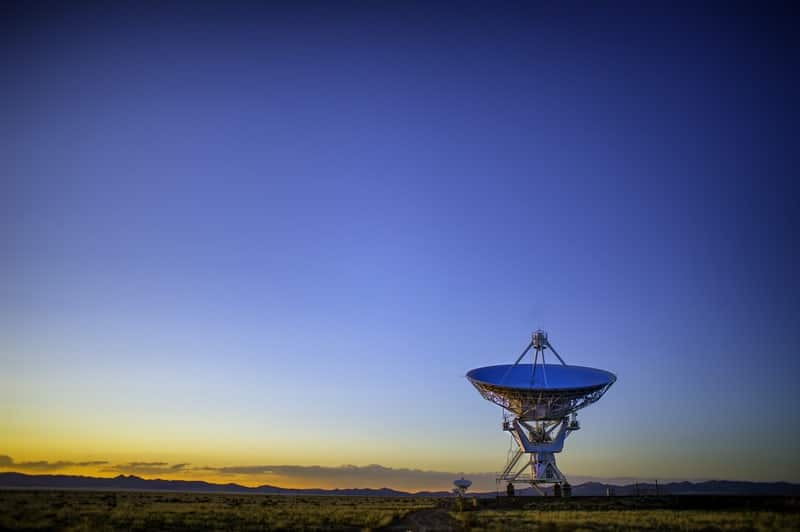 satellite dish pointing up sky